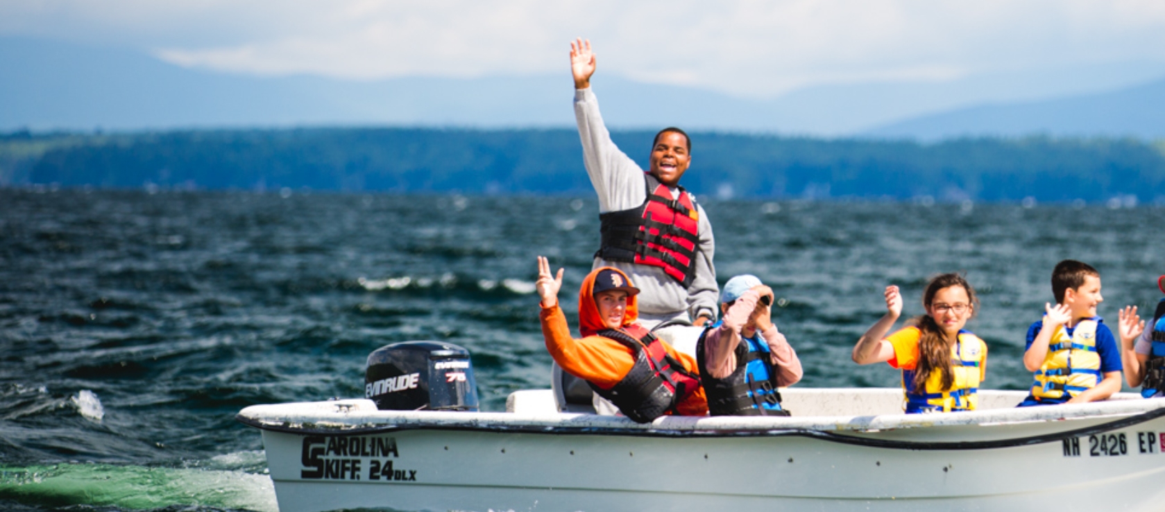 Campers and staff on motorboat