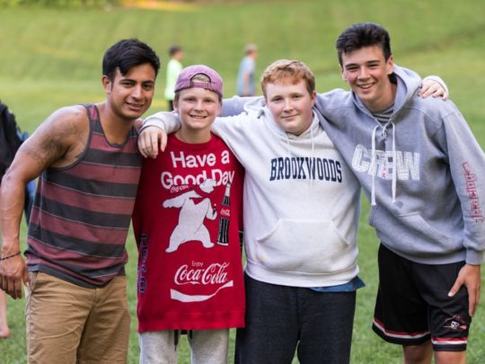 Four Brookwoods boys at BASIC camp smiling