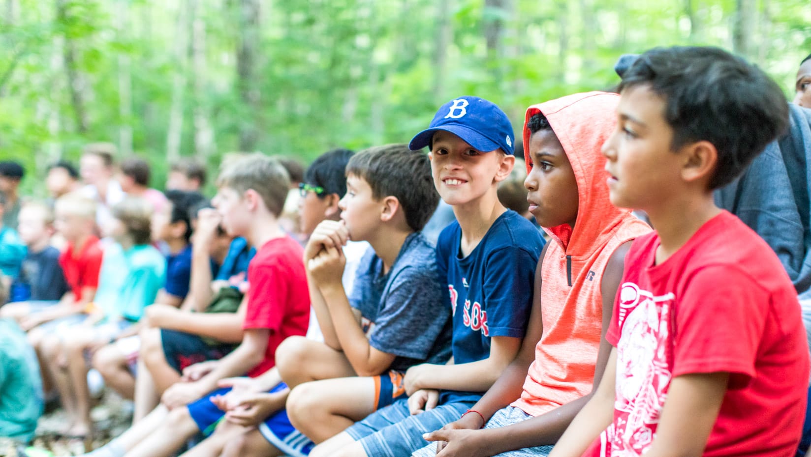 Campers sitting and participating in the camp circle