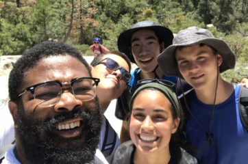 Four hikers smiling on the Leadership Development Program