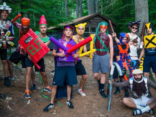 staff wearing medieval costumes outside