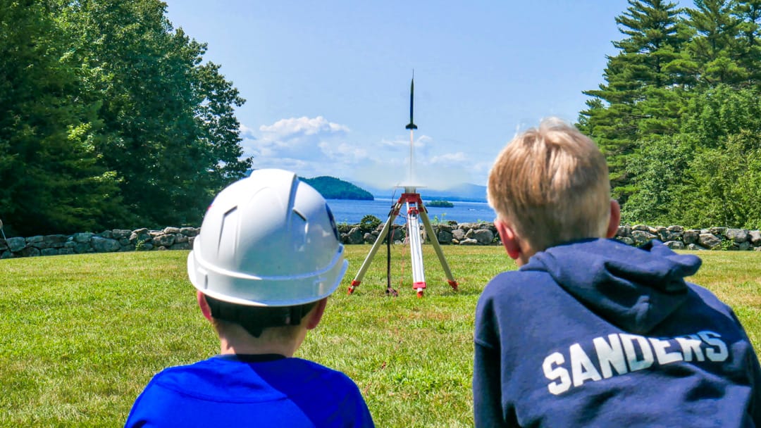 Two Brookwoods boys watching their rocket launch