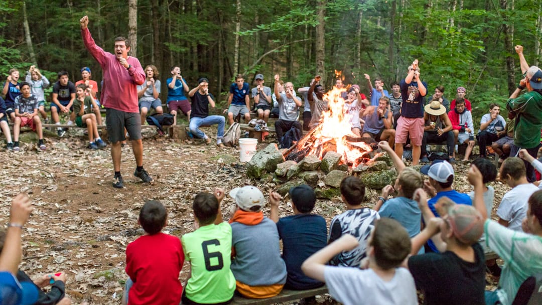 Staff leading the camp circle fire