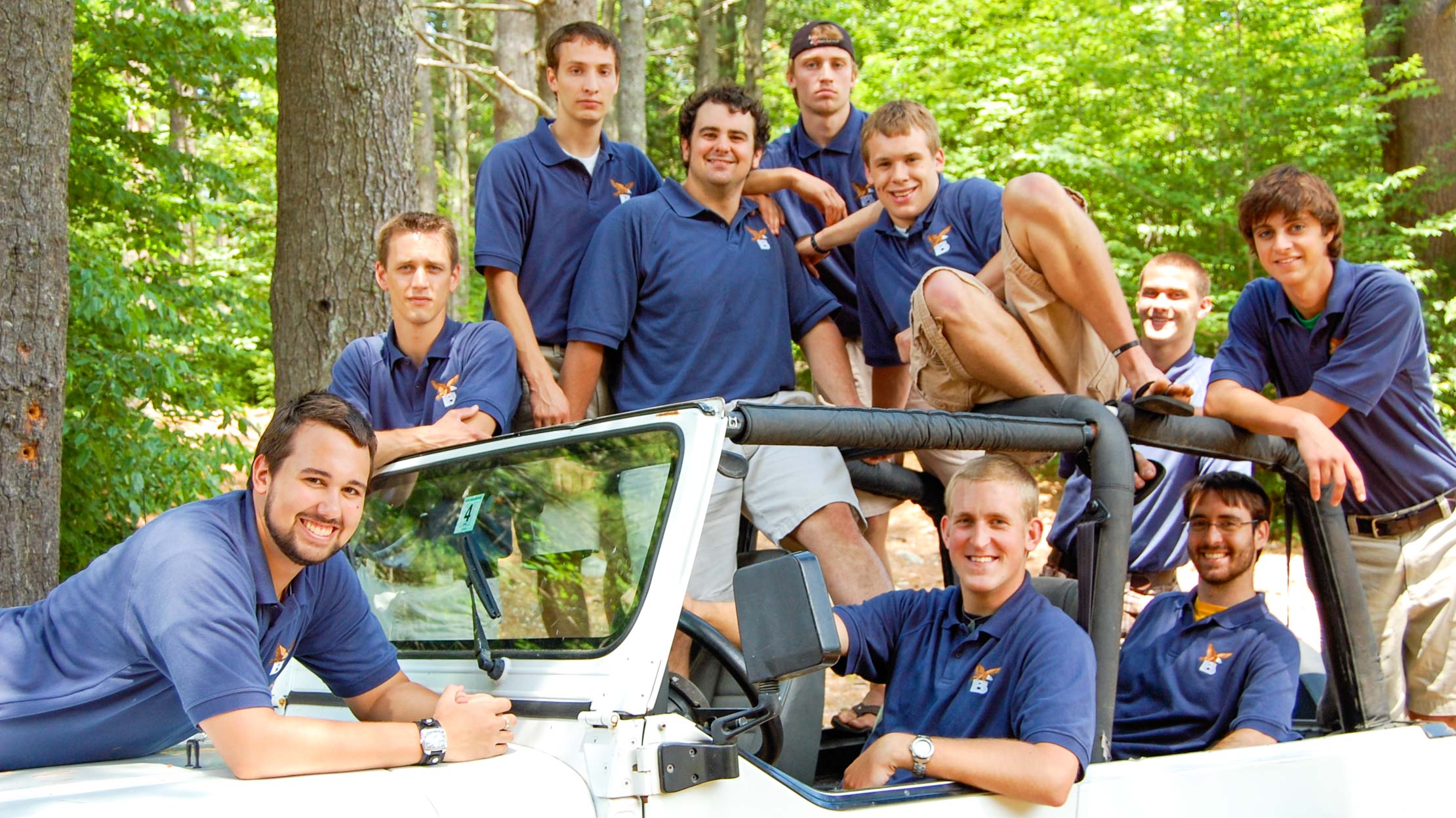 Brookwooods staff sitting on jeep