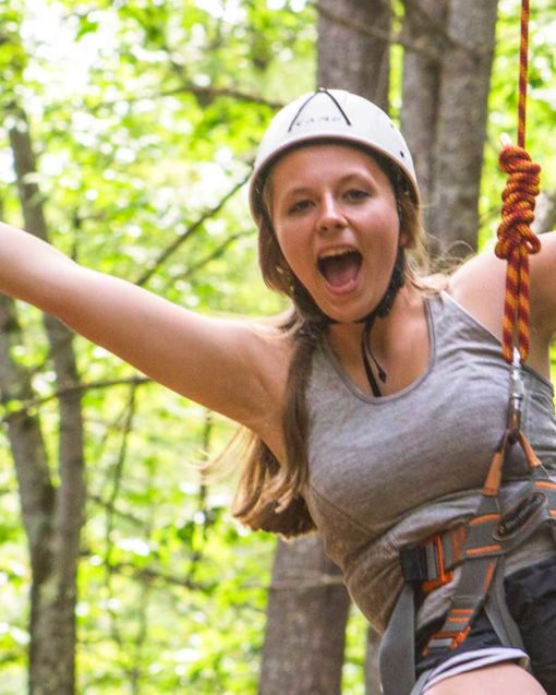 Camper on the ropes course during basic camp