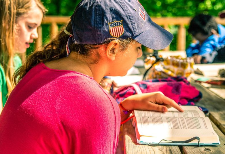 Girls reading bible for bible study