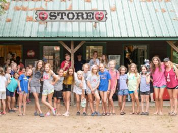 Campers standing by camp store