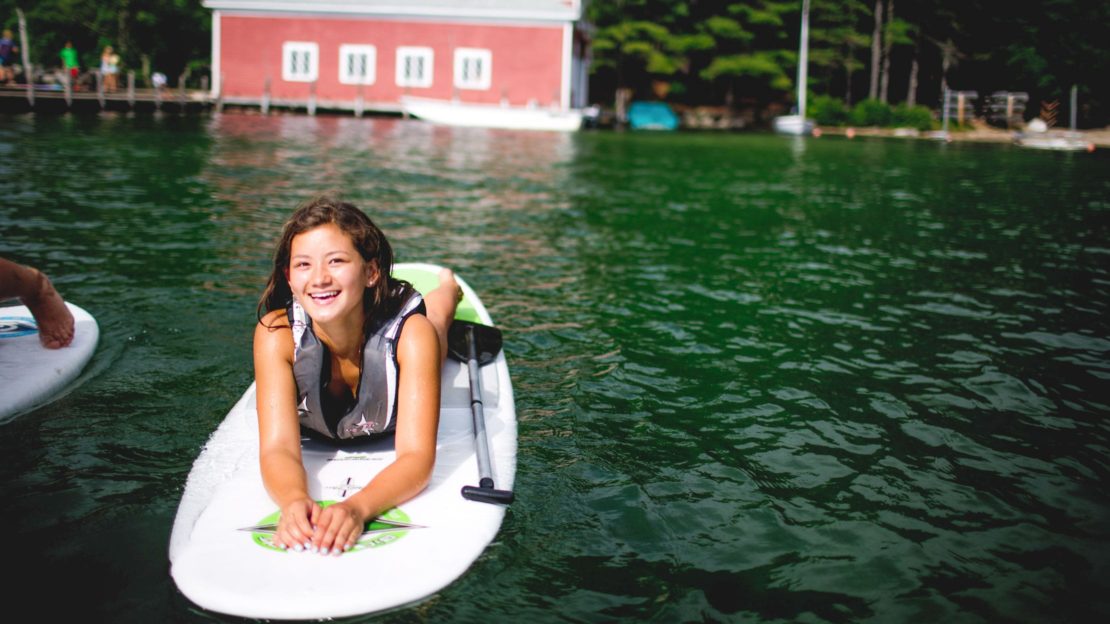 Girl on stand up paddle board