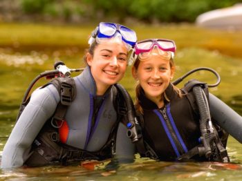 two girls wearing SCUBA gear