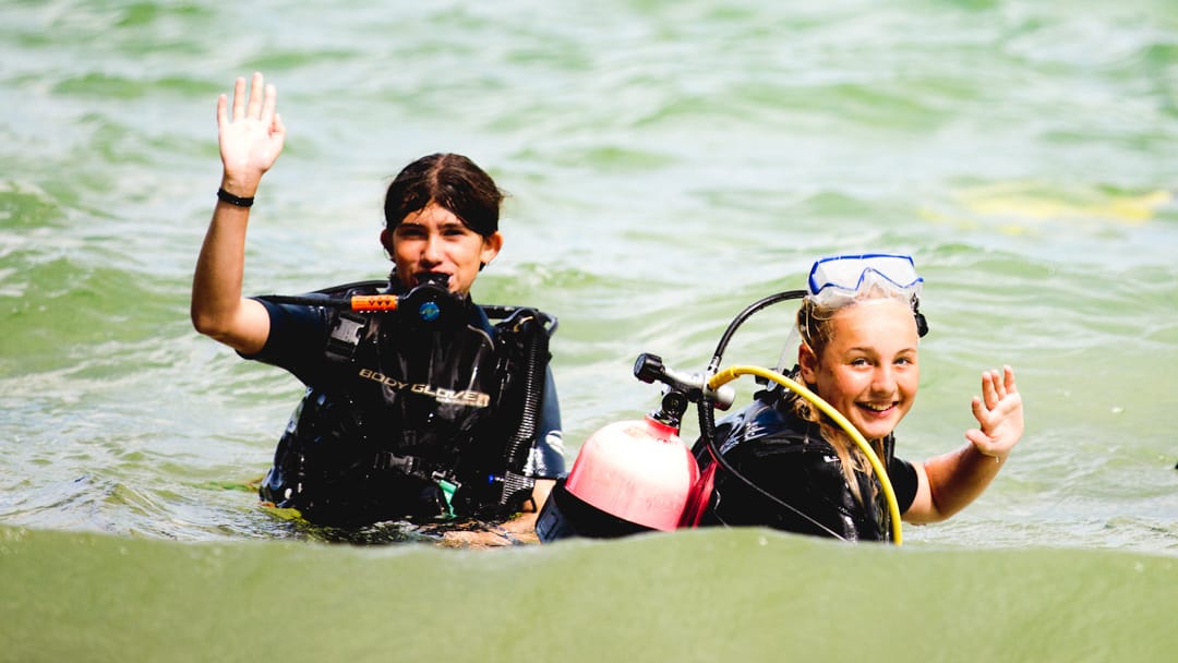 Two campers wearing SCUBA gear