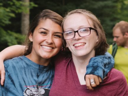 Two female campers at Moose River smiling