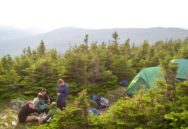 Campers setting up tents on an MRO overnight trip