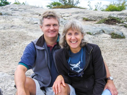 Bob Strodel and wife Debbie sitting on rocks