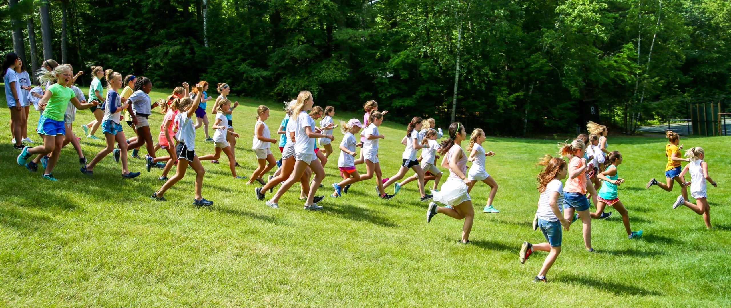 Deer Run campers running down a hill