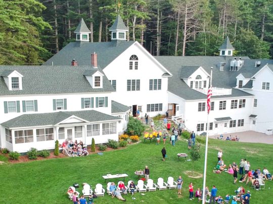 Aerial main building and alumni on lawn during alumni camp on Labor Day weekend