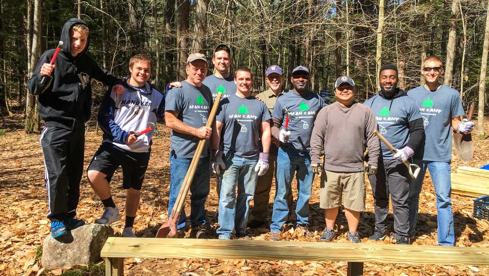 Alumni raking at Man Camp