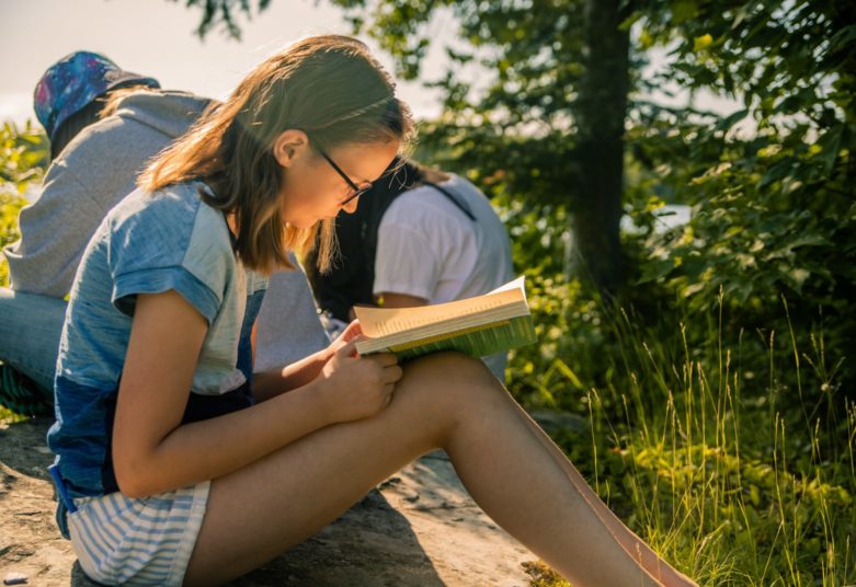 Girl reading outside