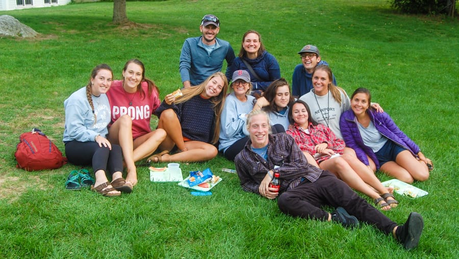 Teens eating on the grass at the Labor Day Weekend