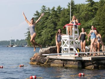 Girl jumping off a diving board