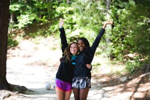 Two campers waving